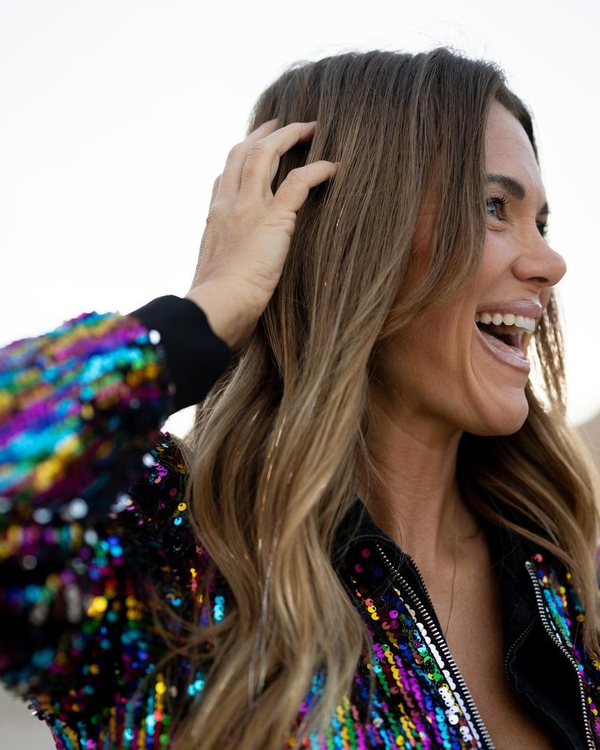 Megan laughing, gold strands catching the light through her hair